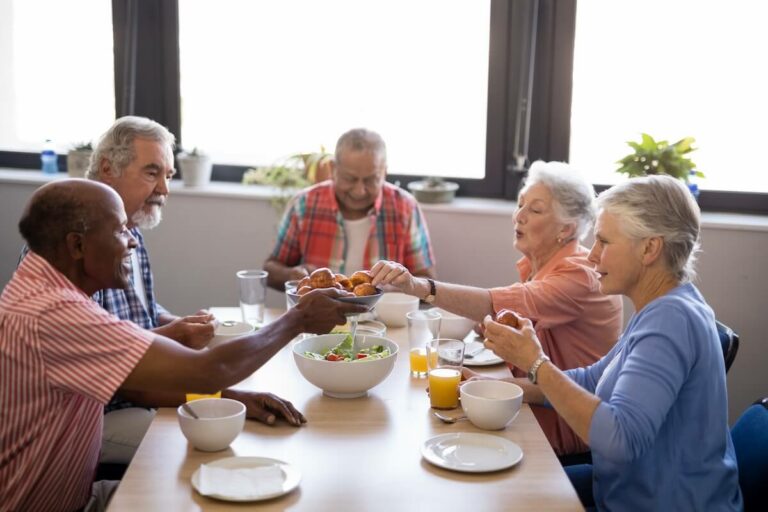 The Philomena | Group Sharing A Meal