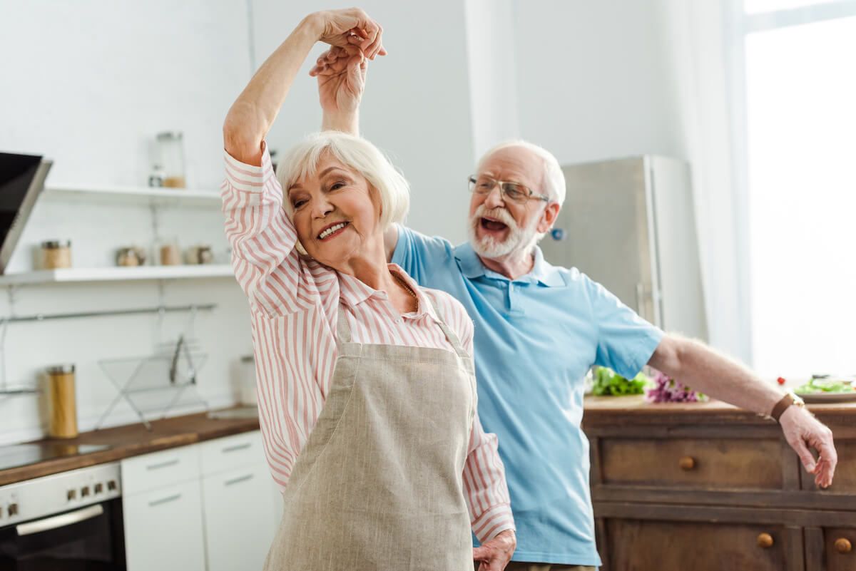The Philomena | Senior couple dancing in the kitchen