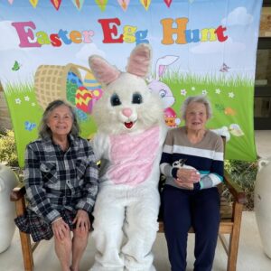 The Philomena | Residnets take a photo with the Easter bunny