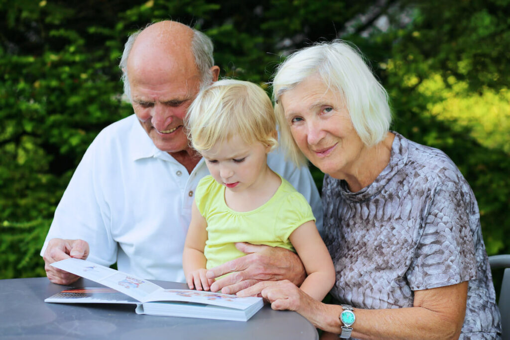 The Philomena | Senior couple spending time with their grandchild